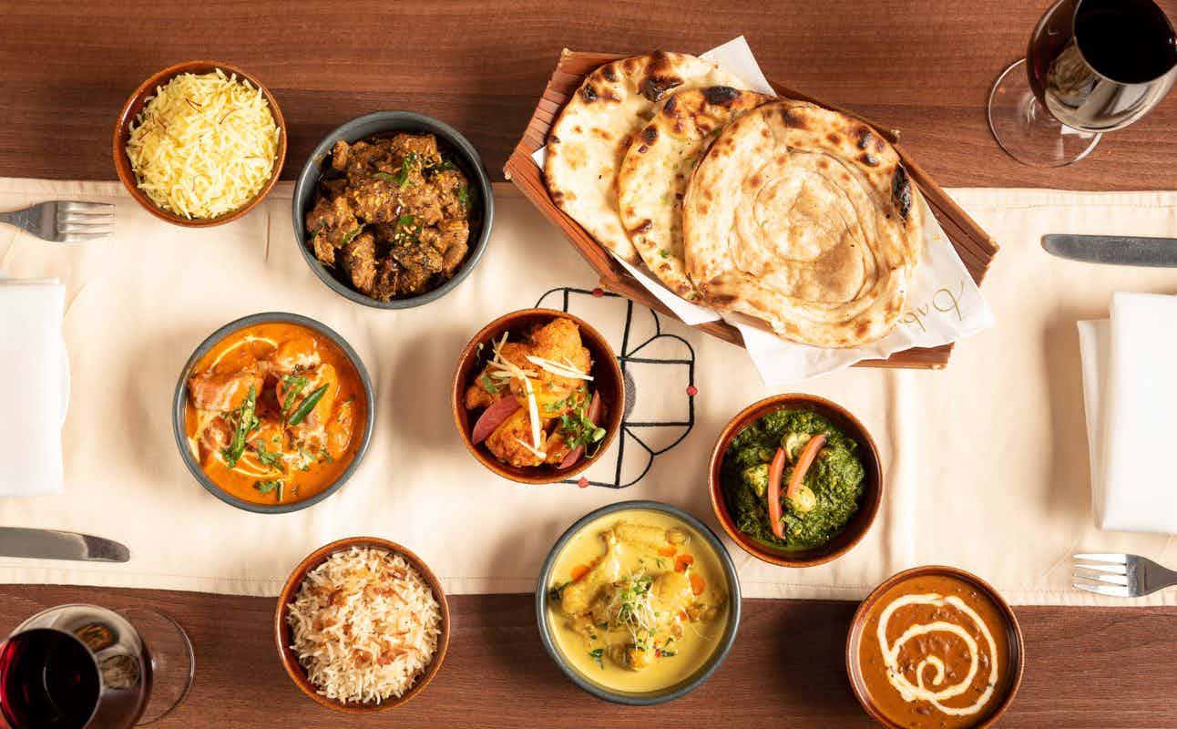 Enjoy Indian, Asian, Vegan Options, Vegetarian options, Gluten Free Options, Restaurant, Highchairs available, Wheelchair accessible, Free Wifi, $$, Families and Groups cuisine at Babur in Brockley, London