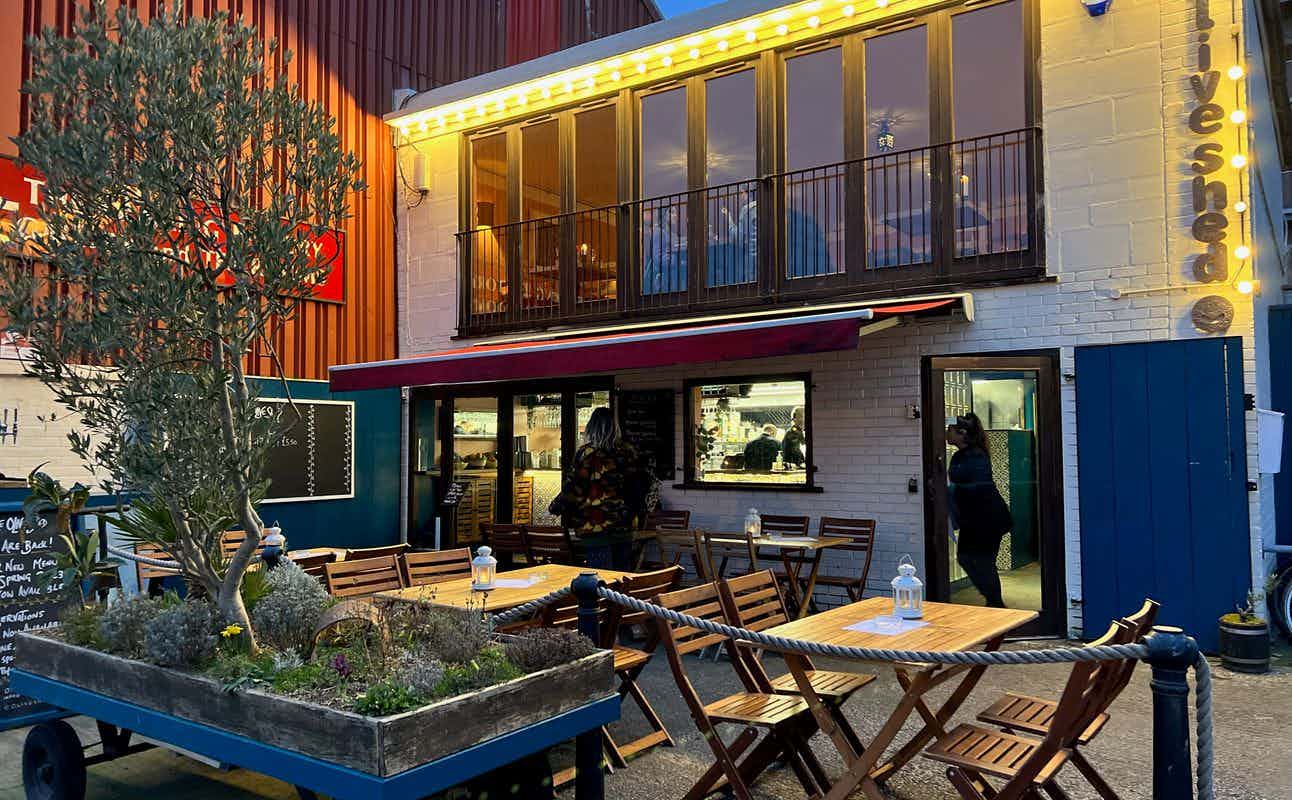 Enjoy Mediterranean, European, Spanish, Vegan Options, Vegetarian options, Gluten Free Options, Restaurant, Indoor & Outdoor Seating, Highchairs available, $$, Live music, Families and Groups cuisine at The Olive Shed in Wapping Wharf, Bristol