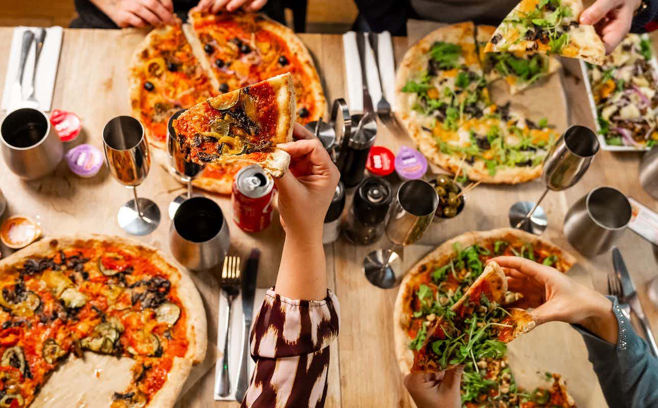 Enjoy Italian, Pizza, Vegan, Gluten Free Options, Vegan Options, Vegetarian options, Restaurant, Highchairs available, Table service, Dog friendly, Street Parking, Private Dining, Indoor & Outdoor Seating, $$, Families and Groups cuisine at The Pizza Room Hackney in Hackney, London